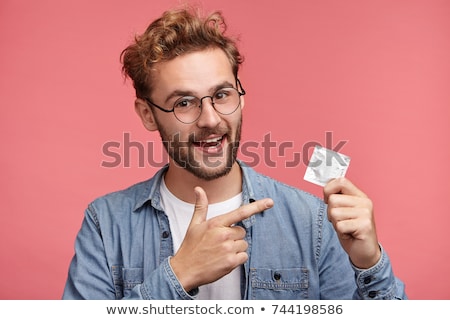 Foto stock: Condom On The Finger