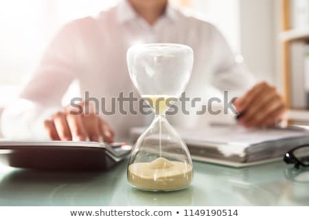 Stok fotoğraf: Businessman Holding Hourglass