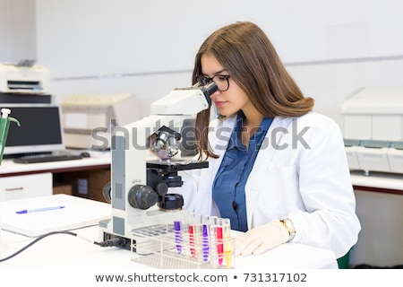 Stock photo: Portrait Of Beautiful Young Woman In A Laboratory