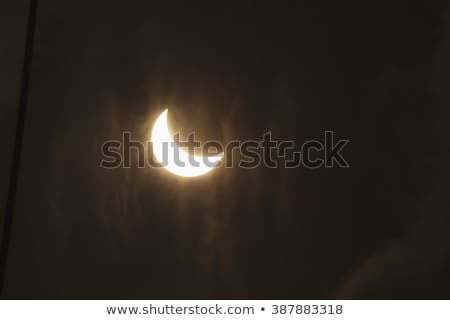 Stock fotó: Partial Solar Eclipse Through Clouds