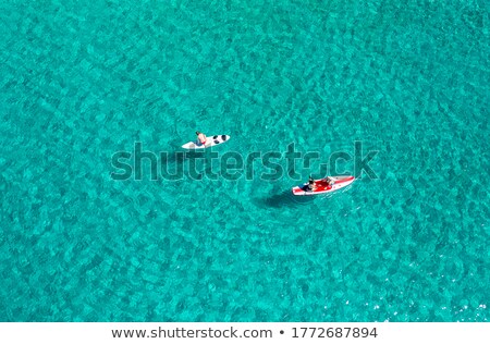 Foto stock: Aerial View Of Unrecognizable People Stand Up Paddle Boarding