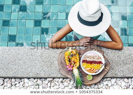 Сток-фото: Woman At Tropical Beach Eating Fruit For Breakfast