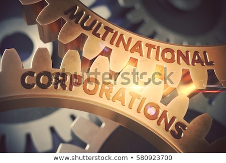 Foto stock: Multinational Corporations Concept Golden Metallic Gears