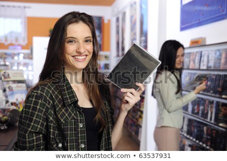 Teenage Girl Holding Dvd Imagine de stoc © mangostock