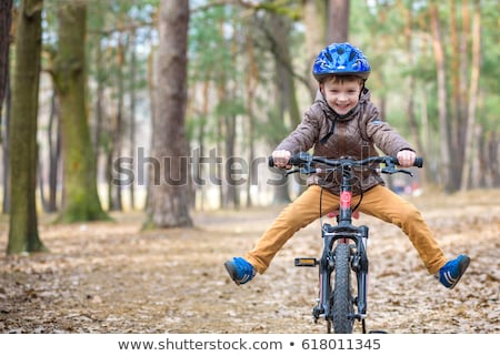 ストックフォト: Happy Kid Boy Of 5 Years Having Fun In The Park With A Bicycle On Beautiful Day