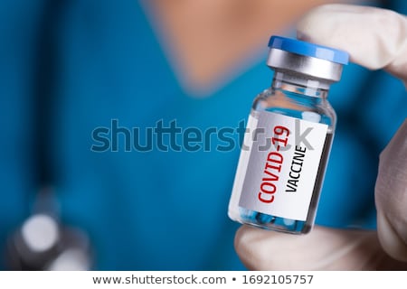 Foto stock: Syringe Medical Injection In Hand Coronavirus Vaccine Concept