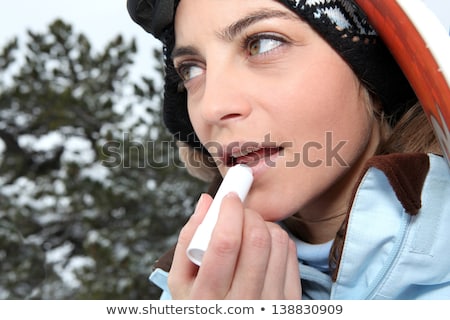 Zdjęcia stock: Portrait Of A Skier Applying Lip Balm