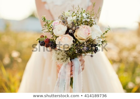 Сток-фото: Bride Holding Wedding Bouquet And Groom