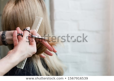 Foto stock: Close Up Of Male Stylist With Brush At Salon