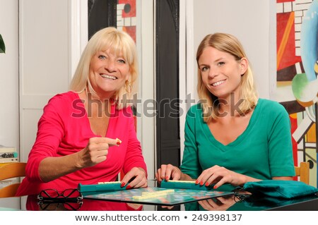 Сток-фото: Happy Senior Woman Playing Scrable With Daugther