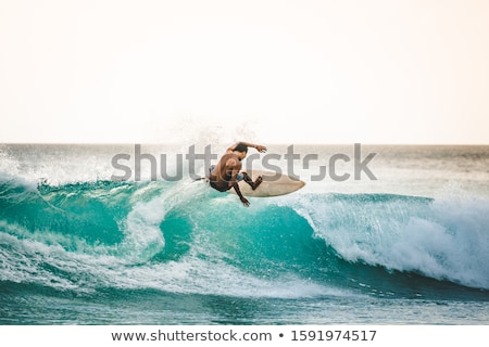 Foto stock: A Young Surfer Surfing A Big Wave