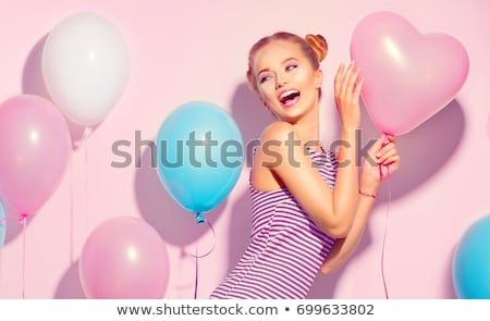 Сток-фото: Portrait Of A Cheerful Young Girl In Dress