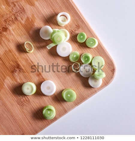 Stockfoto: Sliced Leek Onions On A Wooden Board On A Gray Background With Copy Space Flat Lay