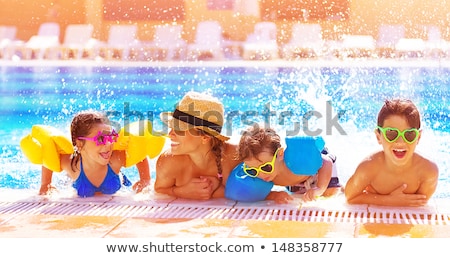 Stockfoto: Little Girl Having Fun In The Water Park