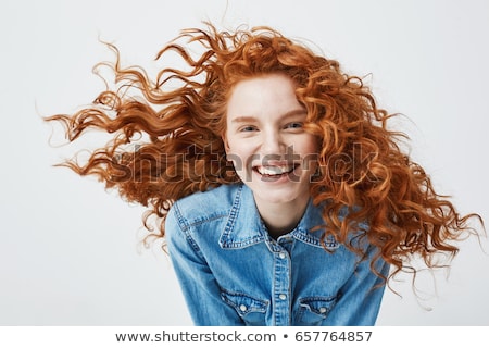 Zdjęcia stock: Portrait Of Cheerful Young Girl With Curly Hair