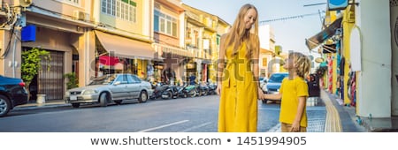 Foto d'archivio: Banner Long Format Mom And Son Tourists On The Street In The Portugese Style Romani In Phuket Town