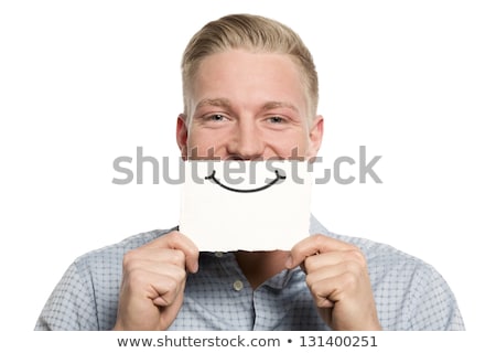 Foto stock: Person Holding Card In Front Of His Mouth