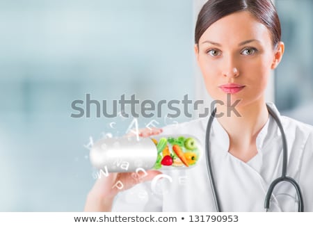 Stok fotoğraf: Healthy Life Concept Female Medical Doctor Holding Vitamins