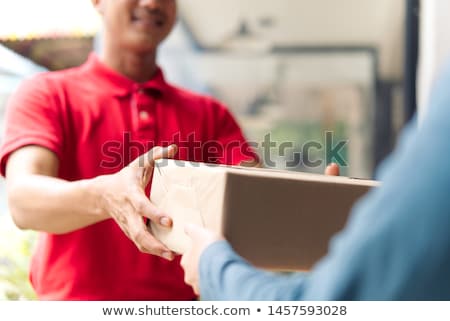 Stock photo: A Smiling Postman