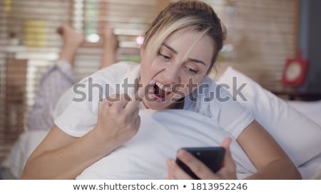 Foto stock: Middle Finger Gesture By A Young Woman