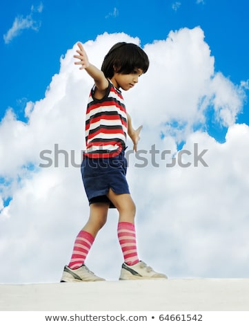 Criança andando e se equilibrando na parede Foto stock © Zurijeta