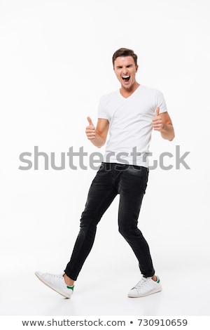Foto stock: Full Length Portrait Of A Cheery Man In White T Shirt