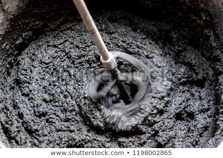 [[stock_photo]]: Concrete Mixing With Electrical Drill And Mixer