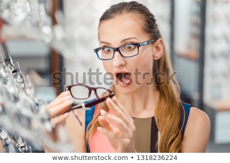 Stock fotó: Woman Loving The Design Of Her New Glasses Almost Too Much