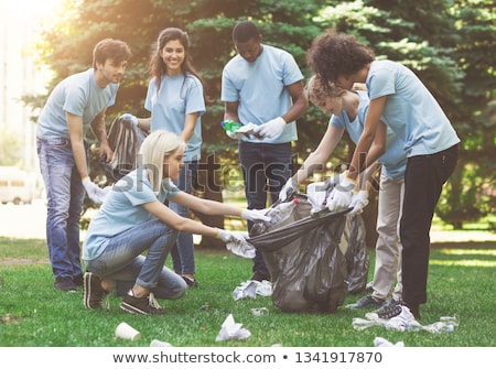 ストックフォト: Group Of Volunteers With Garbage Bags In Park