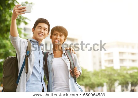 Stockfoto: Asian Woman Student Taking Selfie With Smartphone