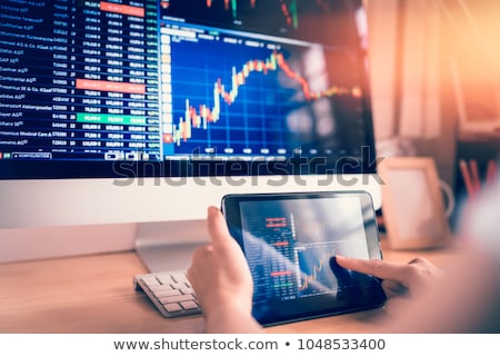 Foto stock: Stock Exchange Trader Analyzing Graphs Chart Or Data On Multiple