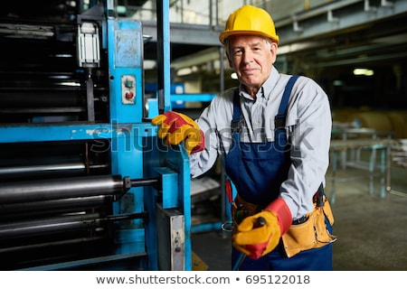Stock photo: Senior Man Operating Machine Units In Modern Factory Standing By