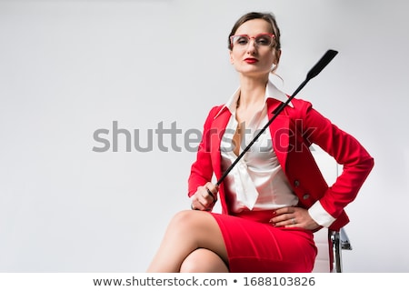 Zdjęcia stock: Arrogant Businesswoman With A Whip In Her Chair