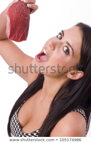 Foto d'archivio: Beautiful Brunette Holds Raw Red Steak Meat