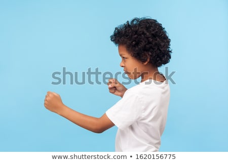 Zdjęcia stock: Little Boy Threatens With A Fist To Fight