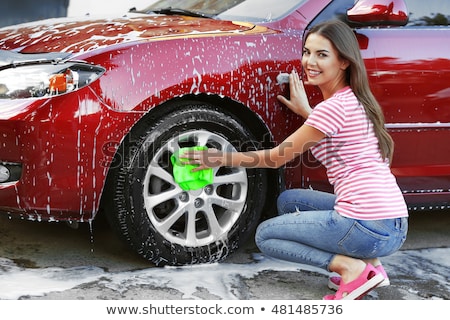 Сток-фото: Woman Washing A Car