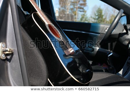 Stok fotoğraf: Music Instrumental Guitar Car Outdoor Background