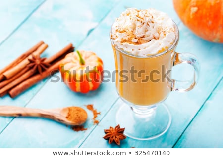 Foto stock: Pumpkin Smoothie Spice Latte With Whipped Cream Turquoise Wooden Background