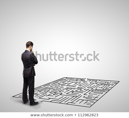 Stockfoto: Thinking Businessman In Front Of Labyrinth