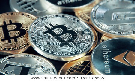 [[stock_photo]]: Gold Coins Standing On Silver Coins