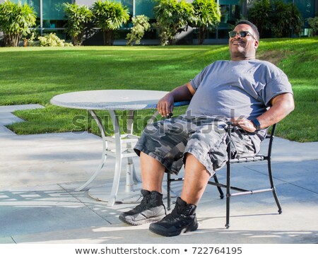 [[stock_photo]]: The Muscular Man Sitting And Resting On Black