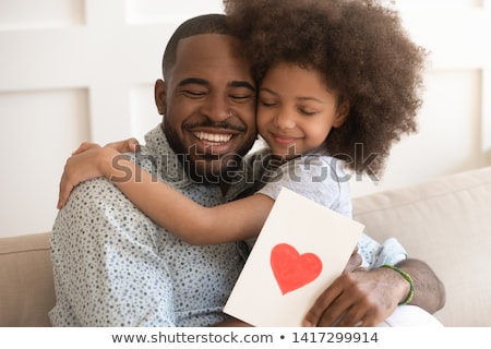 Foto stock: Grateful Man Holding A Gift With A Happy Smile