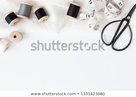 Foto d'archivio: Flat Lay Of Sewing Tool And Accessories On White Wooden Backgrou