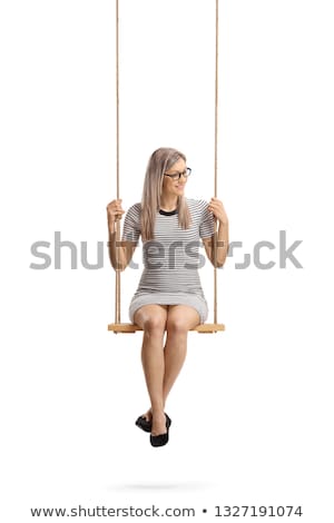 Zdjęcia stock: Woman Sitting On A Swing