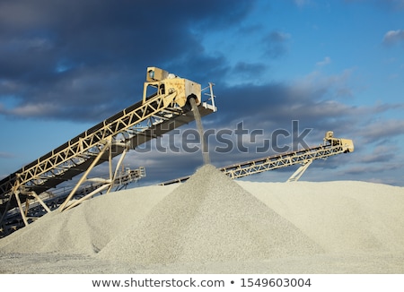 Stock photo: Stone Pile And Machines