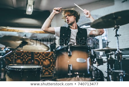 Stockfoto: Male Musician Playing Drums And Cymbals At Concert