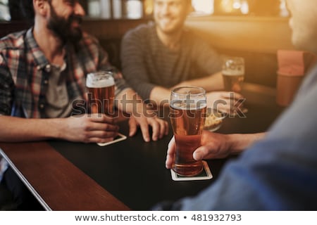 Foto stock: Close Up Of Man Drinking Beer At Bar Or Pub