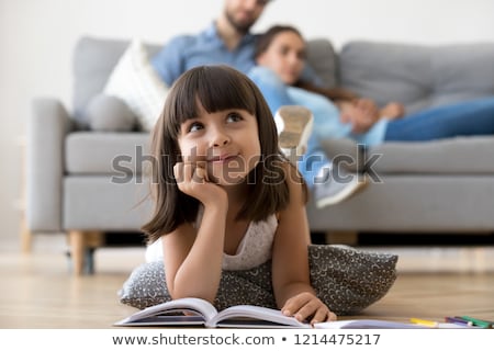Stockfoto: Close Up Of Couple Reading Book At Home