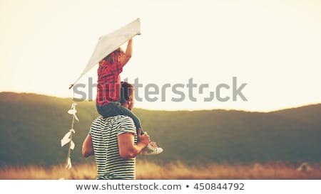 ストックフォト: Father And Child On Meadow With A Kite In The Summer