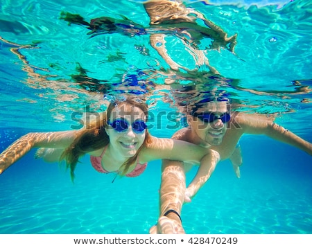 Stok fotoğraf: Couple In Love Refreshing Underwater On Vacation Diving